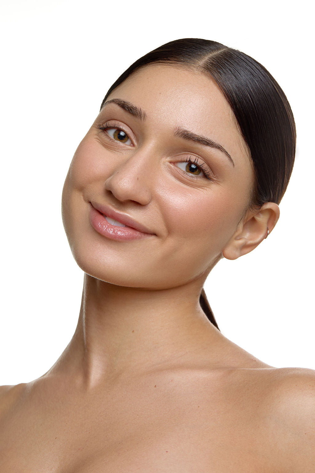woman with brown hair against a white background