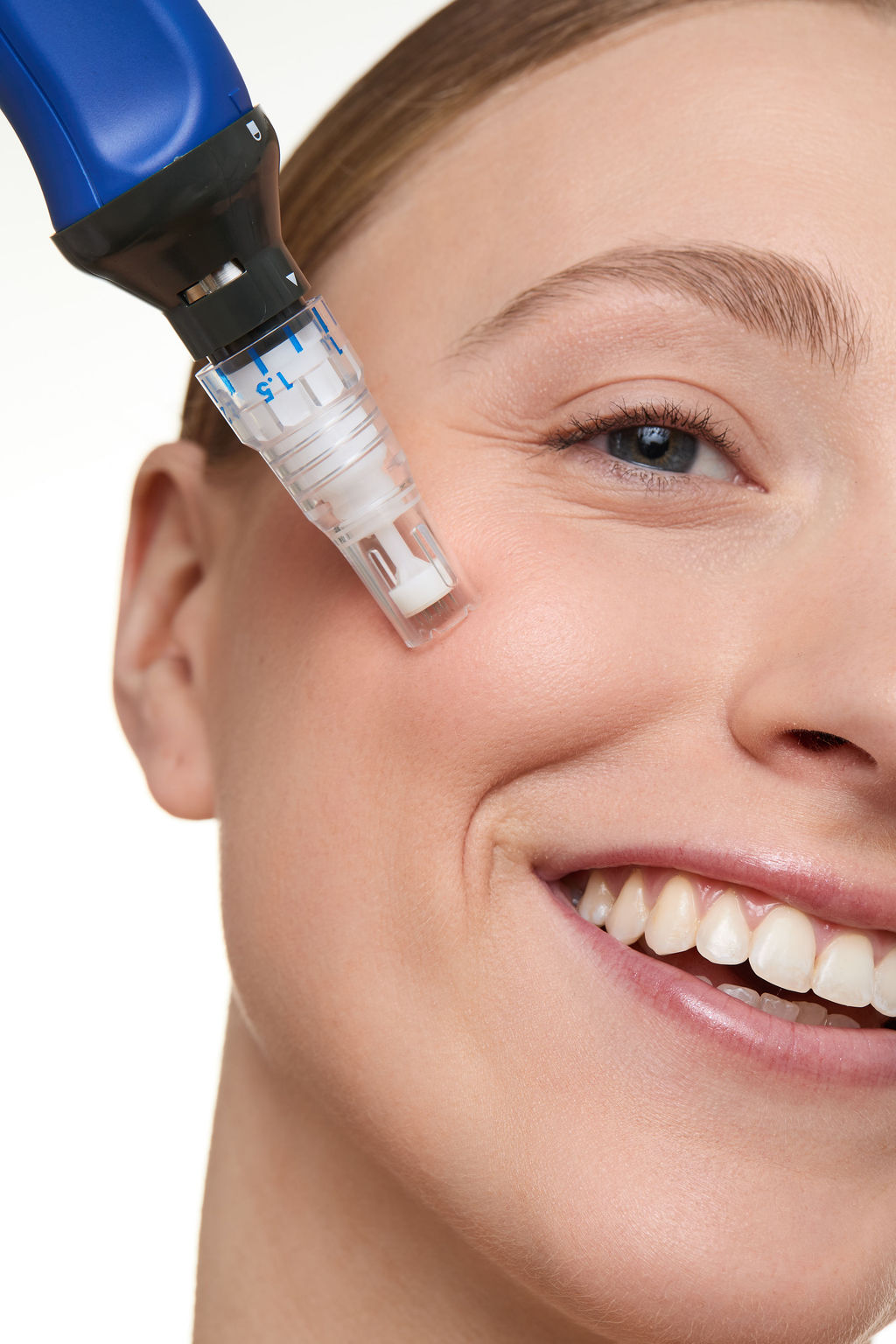 Woman receiving a facial treatment with a device on her face