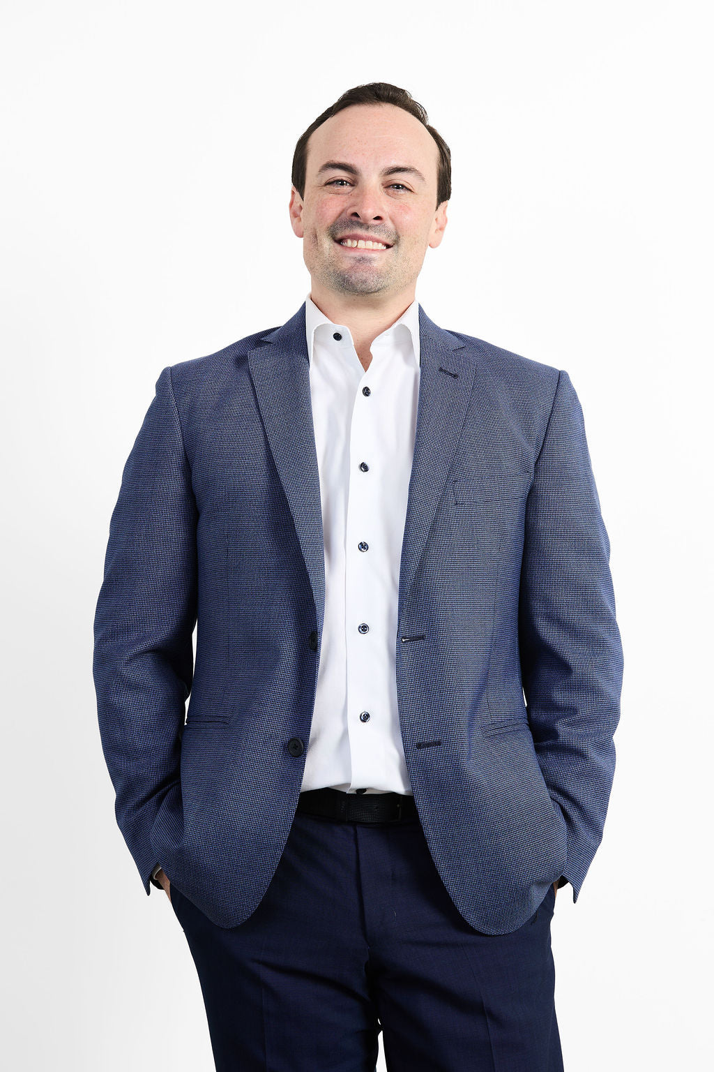 Dr. Clohosey wearing a blue suit and white shirt on a white background